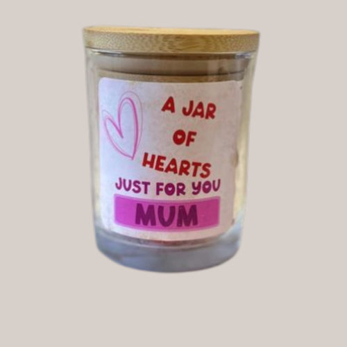 Personalised jar of hearts wax melts — Glass jar filled with heart‑shaped wax melts and personalised text label.