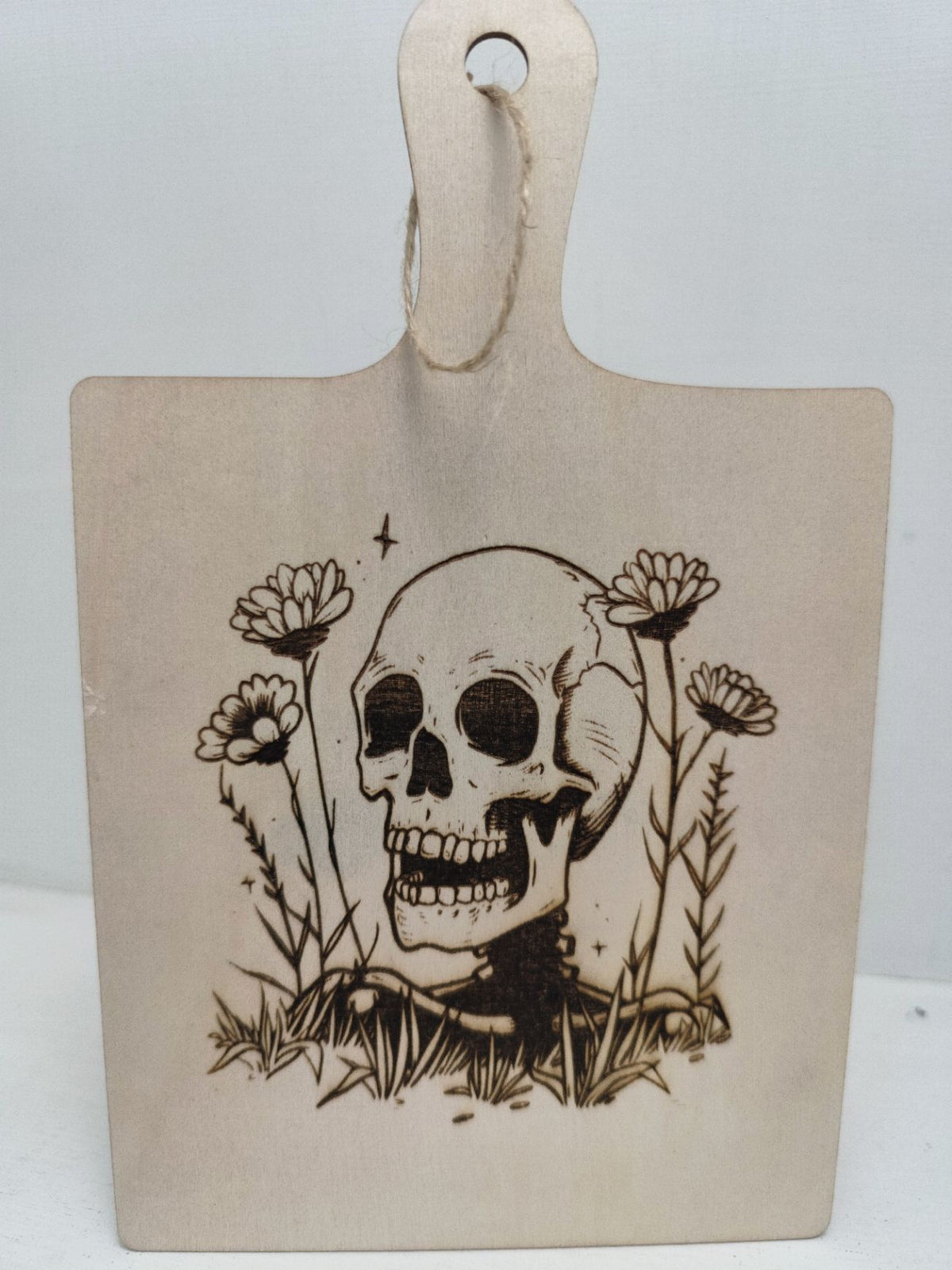 Engraved Halloween skull paddle board sign — Handcrafted wooden paddle board featuring a detailed engraved skull design, ideal for adding spooky Halloween charm to bar carts, kitchens or workspaces.