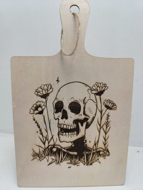 Engraved Halloween skull paddle board sign — Handcrafted wooden paddle board featuring a detailed engraved skull design, ideal for adding spooky Halloween charm to bar carts, kitchens or workspaces.