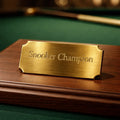 Gold trophy plaque engraved — Gold anodised trophy plaque engraved with custom text for awards or presentations.