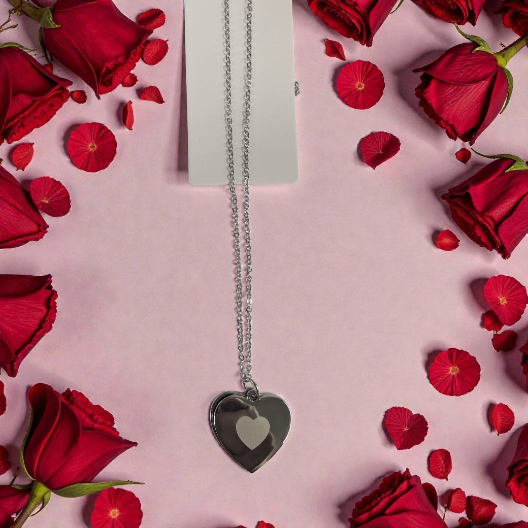 Heart locket with photo and engraving — Polished heart locket containing a printed photo and engraved front text.