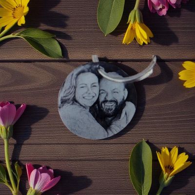 Photo‑engraved circular black anodised keyring — Circular black anodised aluminium keyring engraved with any chosen photo for a personalised finish.